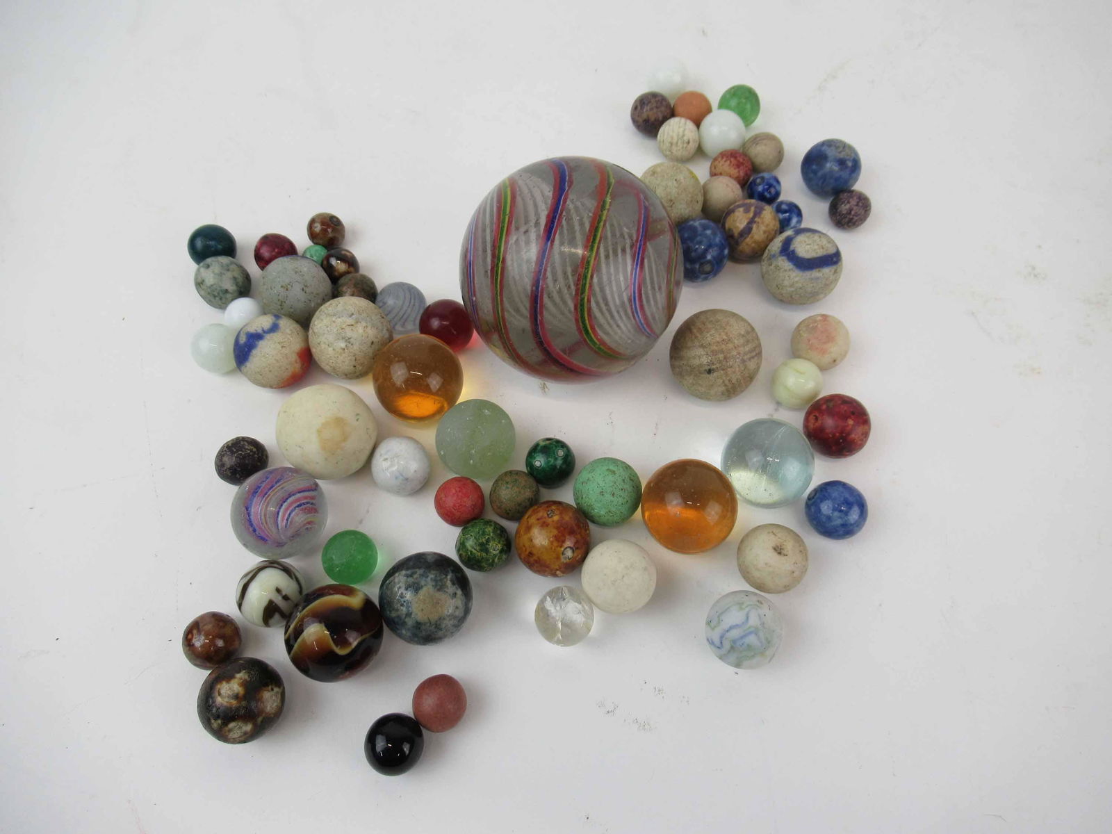 Antique Group of Assorted Glass and Clay Marbles: Antique Group of Assorted Glass and Clay Marbles. Inducing German Latticino, Bennington. Used condition, wear, worn, chips.
