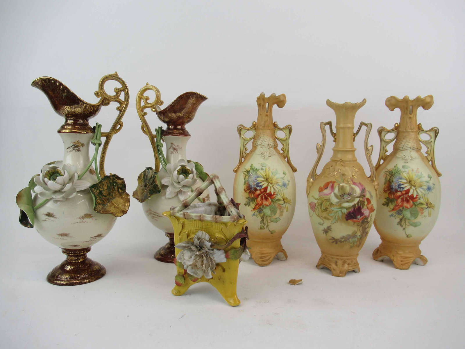 Pair of Moore Bros. Porcelain Ewers: Pair of Moore Bros. Porcelain Ewers with applied leaves and flowers. Together with 3 antique Robert Hanke " RH " Austrian porcelain vases. Used condition, wear, worn, chips to leaves and flowers, loss