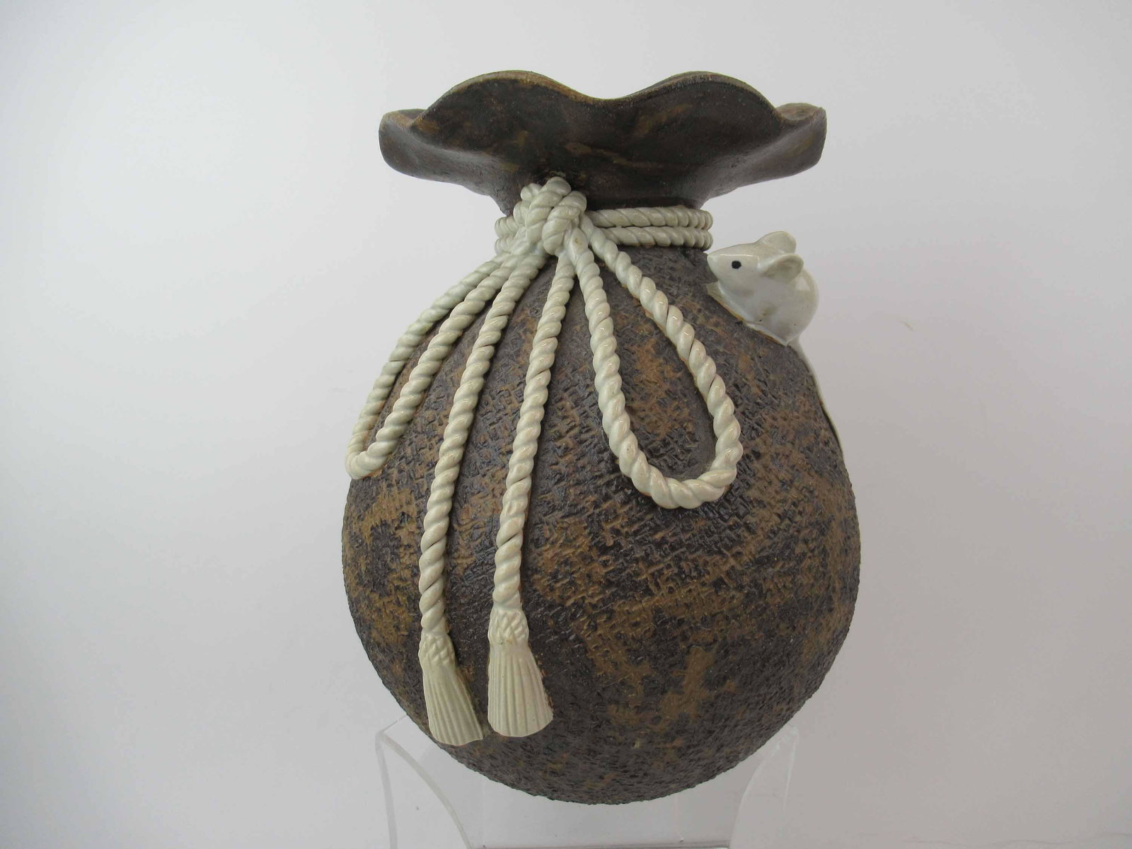 Asian Ceramic Burlap Sack Style Vase: Asian Ceramic Burlap Sack Style Vase depicting mouse trying to get into the rope type bag. Used condition, 11 3/4" tall x 9 1/2" diameter.