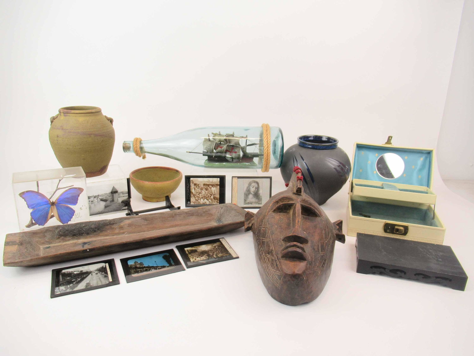 Group of Assorted Table Articles: Group of Assorted Table Articles including vases, bowl butterfly, African mask. Used condition wear, worn.