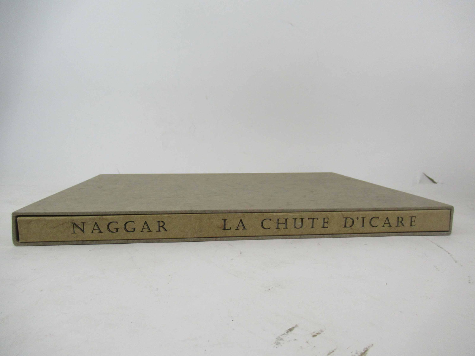 La Chute D'Icare Limited Edition Book: La Chute D'Icare Limited Edition Book by Andre Nagger signed and numbered 14/120 from 1989, Ruth Zilkha. Used condition, 18 1/4" X 13 1/2"
