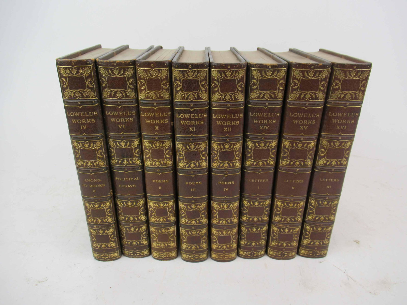 8 Assorted Vol. of Lowell's Works: 8 Assorted Vol. of Lowell's Works. Each marked Limited edition 87/1000 leather bound with gilt decoration. Used condition, wear, worn, fading. 9" x 6"