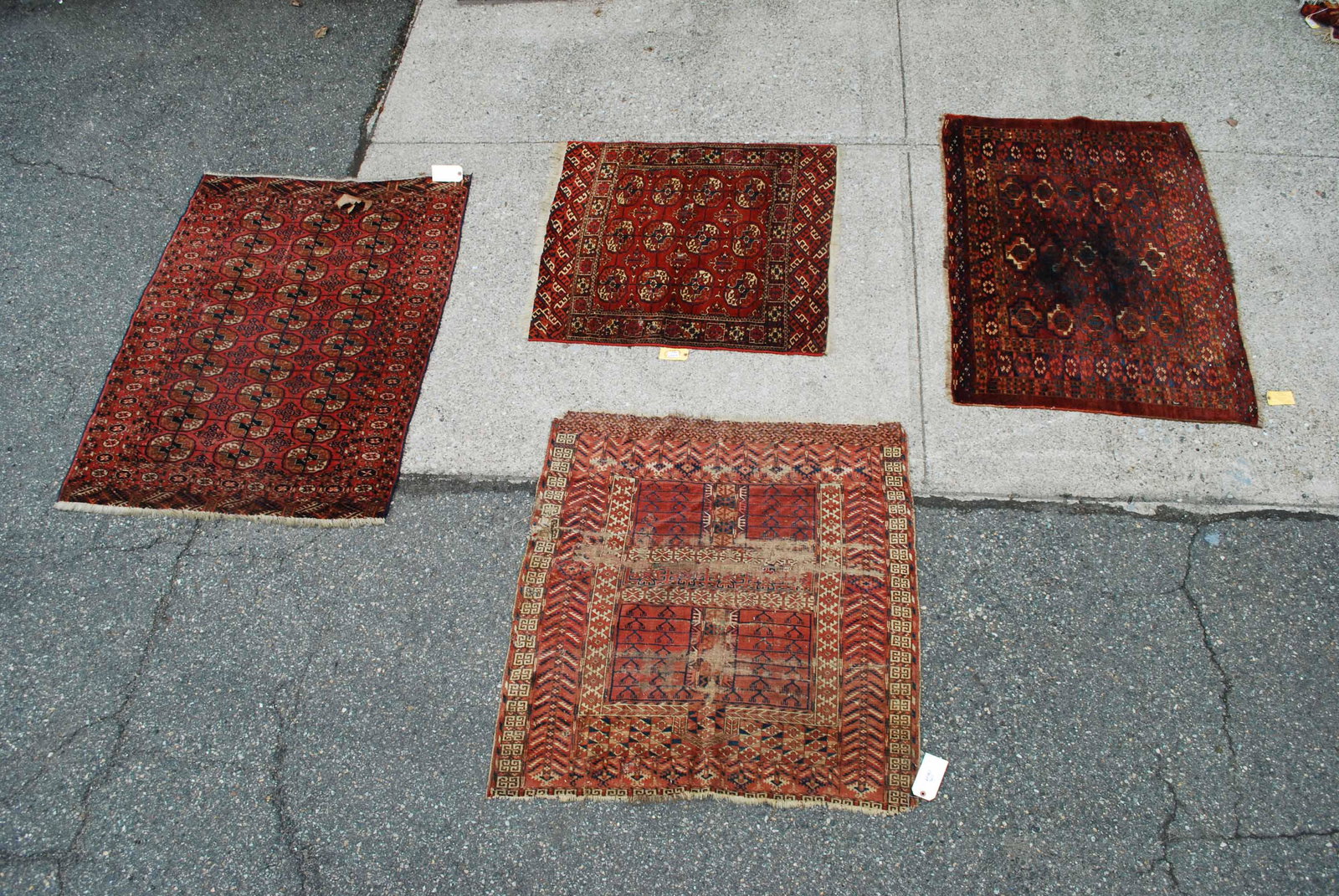 Three Assorted Bokhara Throw Rug: Three Assorted Bokhara Throw Rugs. Together with an orientail throw rug. All in used condition, wear, worn, stains, holes. Larges 5' 1 x 3' 9"