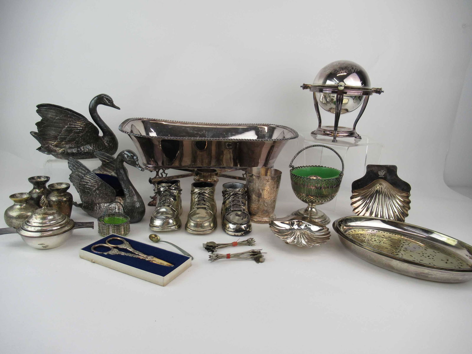 Group of Silver Plated Table Articles: Group of Silverplate Table Articles including butter warmer stamped Benetfink & Co, grape shears, insert warming dish trays, large rectangular shaped serving dish, footed expandable legs, pair of swan