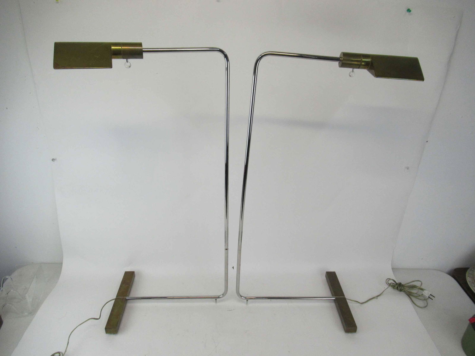 Pair of Modern Cedric Hartman Floor Lamps: Pair of Modern Cedric Hartman Adjustable Floor Lamps. Signed Cedric Hartman on base. Used condition, wear, worn. Short size 36" tall x 16" deep x 11" wide
