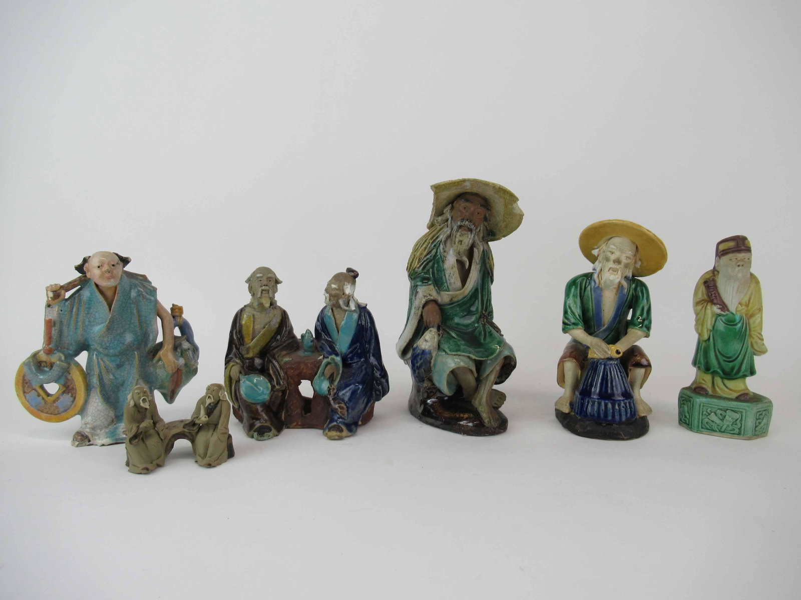 Group of Chinese Mudman Pottery Figures: Group of Chinese Mudman Earthenware Pottery Figures; used condition, wear/worn, some with chips and breaks, largest measures 6 3/4" high x 3 3/4" long x 3 1/4" wide