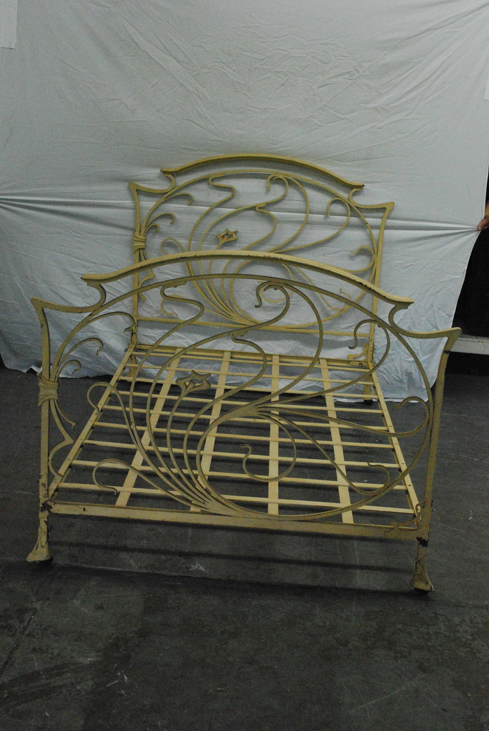 Art Nouveau Style Iron Bedstead: Art Nouveau Style Iron Bedstead, fits custom size mattress. White Painted Bed. used condition, paint losses, missing bolts and screws. size 45" x 76"
