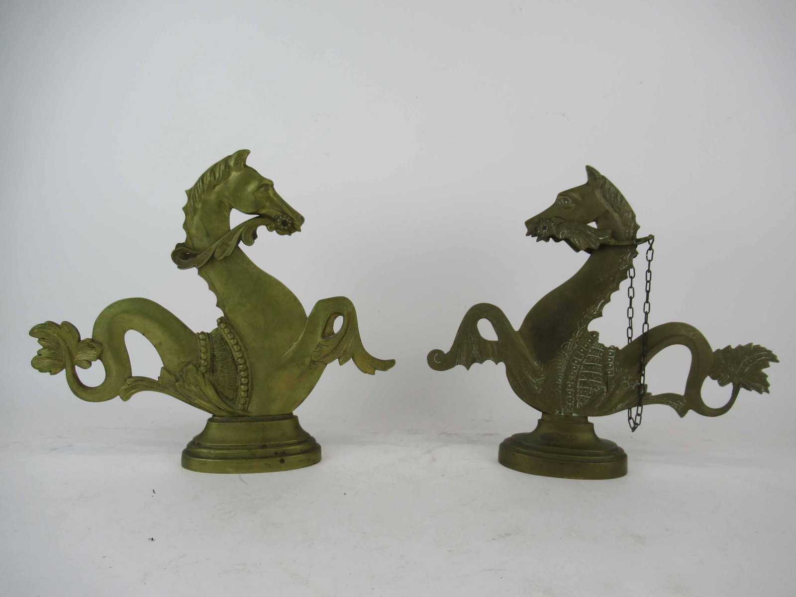 Near Pair of Hippocampi Brass Seahorse Doorstops: Near Pair of Hippocampi Brass Seahorse Doorstops. Used condition, wear, one missing reins. Tallest 11 1/2" tall x 13 1/4"