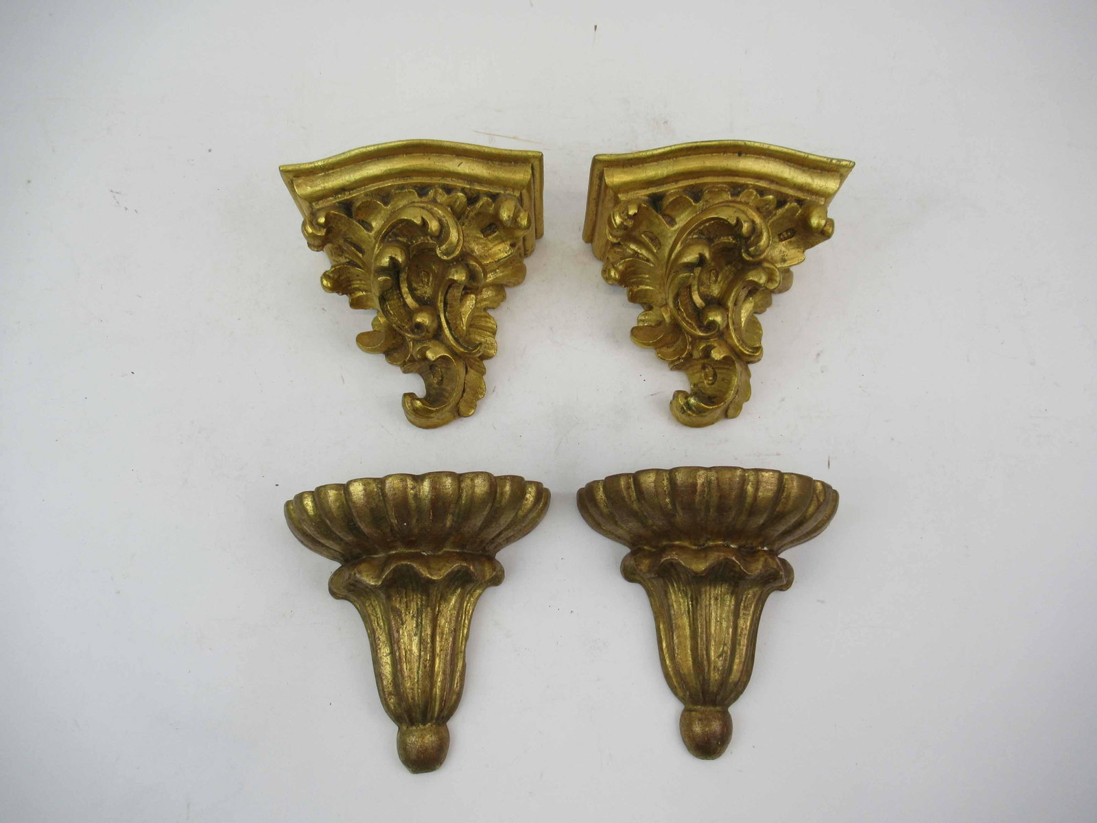 Two Pairs of Italian Giltwood Wall Brackets: Two Pairs of Italian Giltwood Wall Brackets. Used condition, minor chips. Largest 7" tall x 7" wide x 3 1/2" deep.