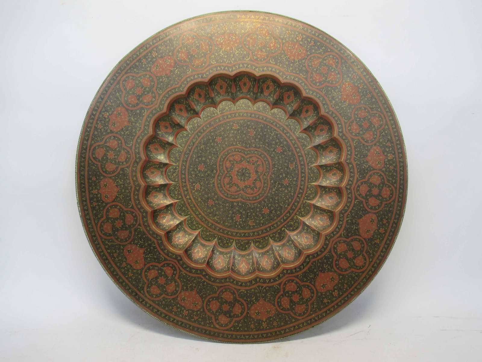 Large Persian Colored Brass Charger: Large Persian Colored Brass Charger. Red and Black colored. Used condition, wear, worn. 30 1/4" dia