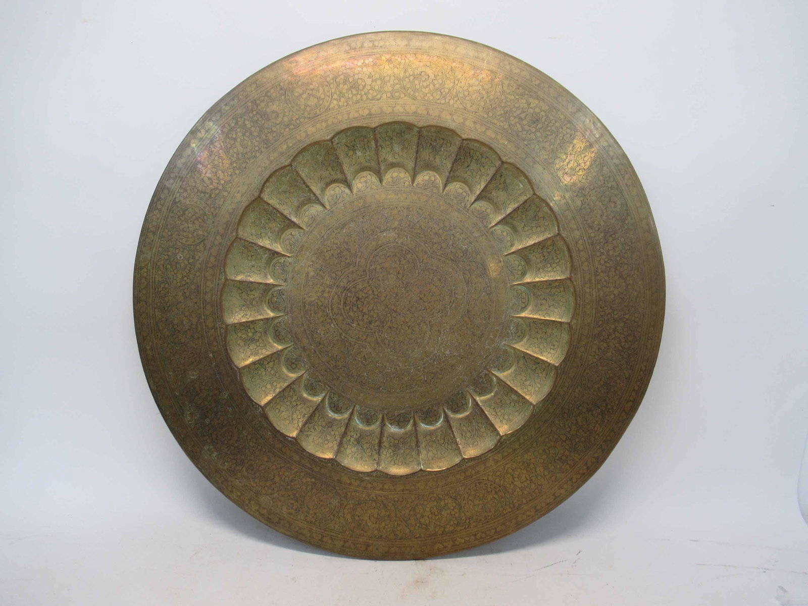 Large Brass Persian Charger: Large Brass Persian Charger having black inlay coloring. Used condition, tarnish, wear, worn. 30" dia