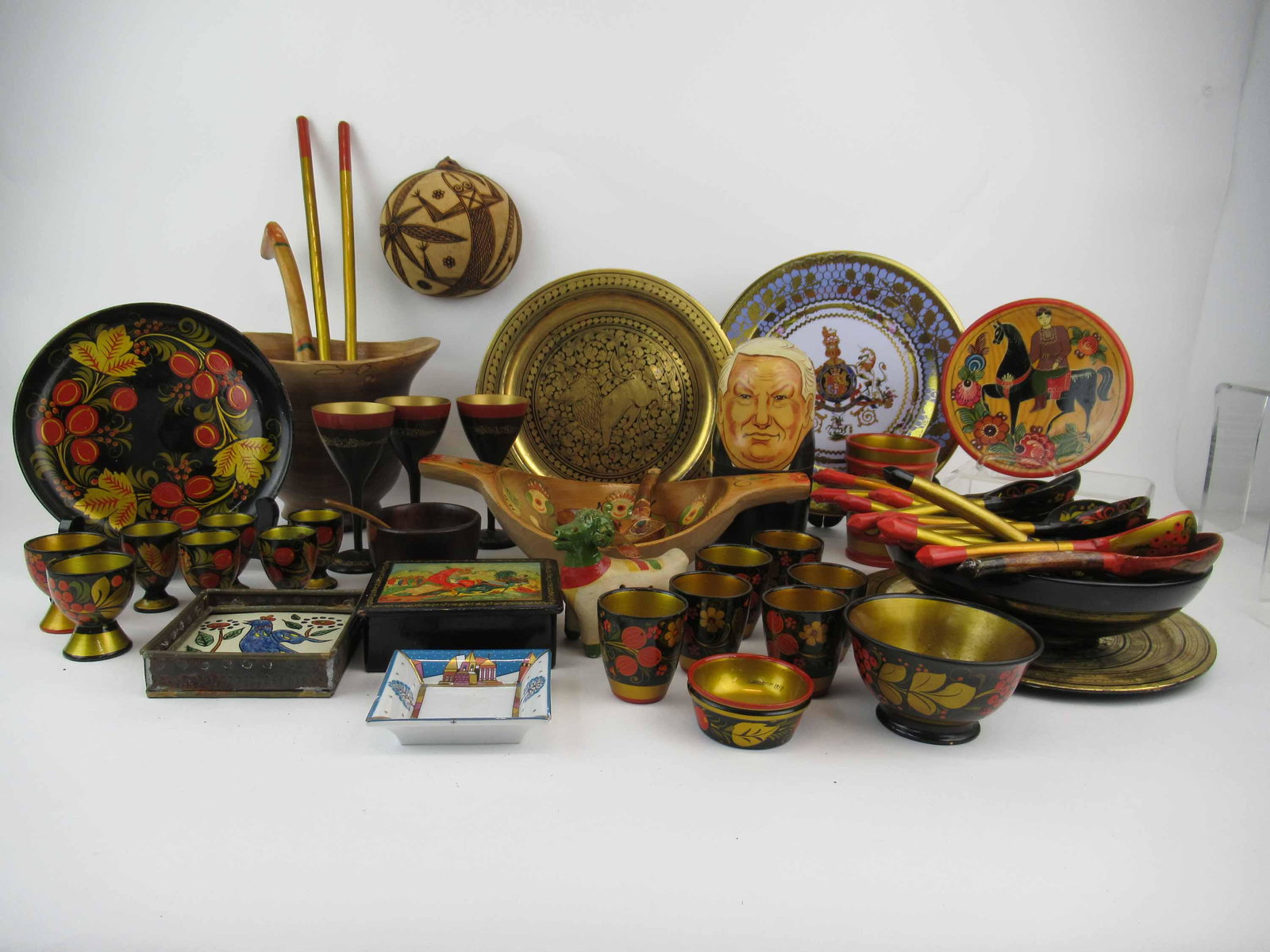Russian Political Wood Nesting Dolls: Together with a large collection of painted wood spoons, plates, turned bowls, and more.