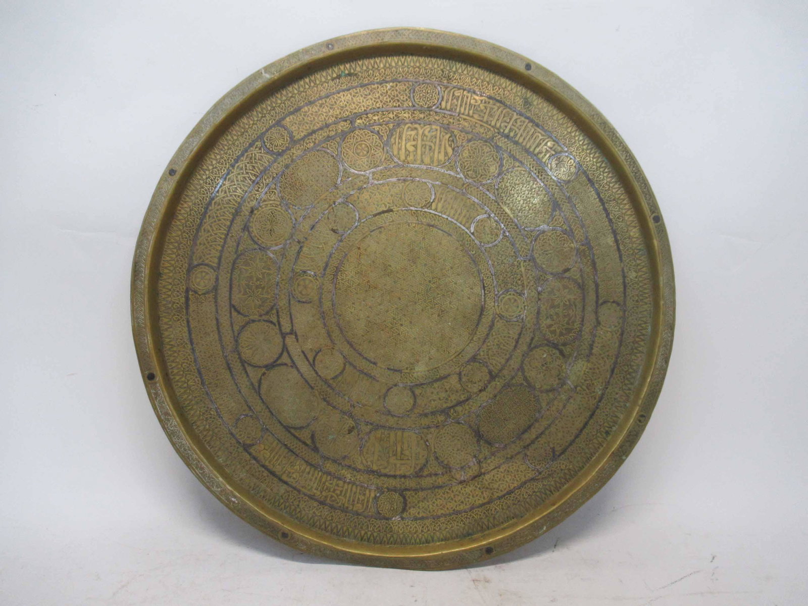 Persian Brass Charger with Metal Overlay: Persian Brass Charger with Metal Overlay. Used condition, dents, dings, losses to overlay. 21" dia