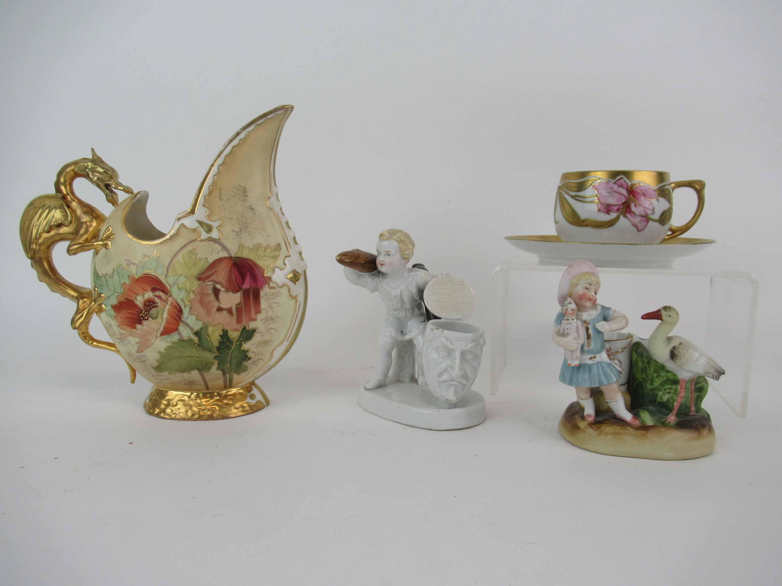 RH Robert Henke Porcelain Dragon Pitcher: RH Robert Henke Porcelain Dragon Pitcher with gilded figural dragon form handle and floral design. Together with 2 porcelain figural match holders and MZ Austria cup and saucer with Iris gilt decorati