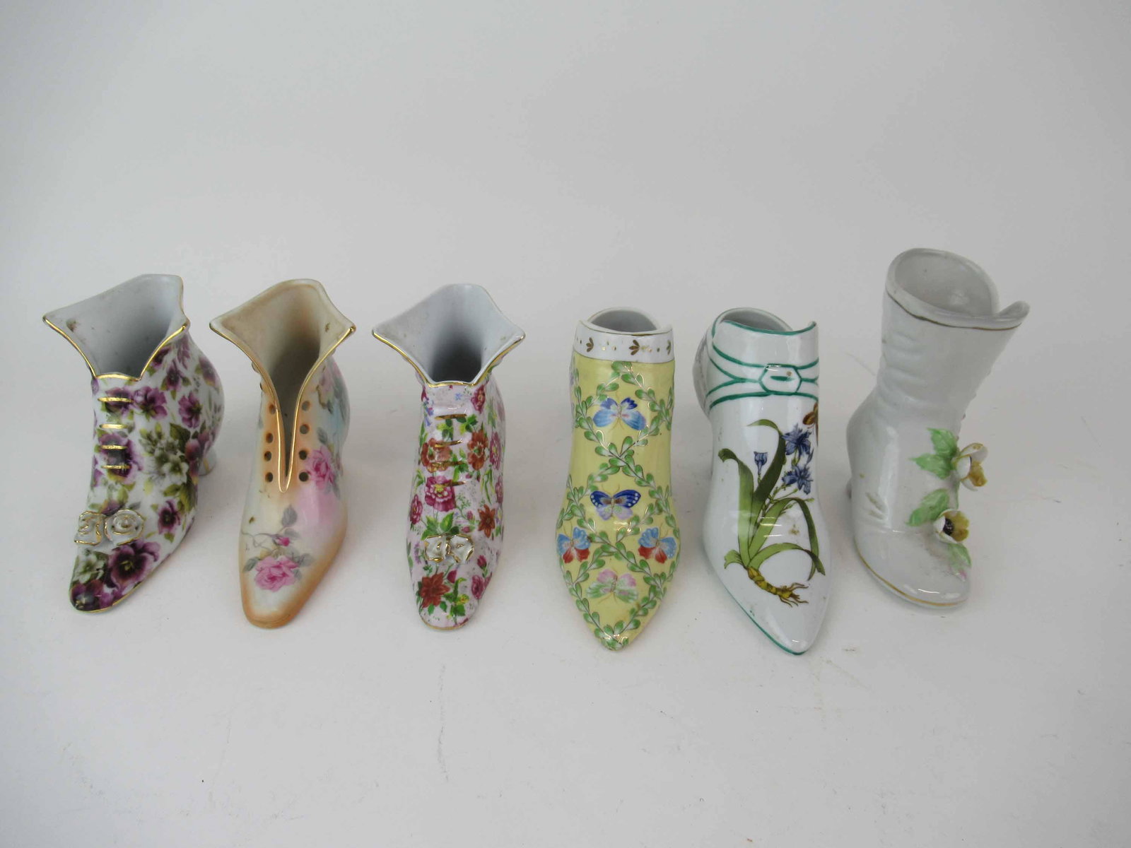 Group of Assorted Porcelain Victorian Boots: Group of Assorted Porcelain Victorian Boots including Formalities by Baum Bros, R & S and one unmarked; wear/worn, largest measures 5 1/8" high x 4 1/8" long