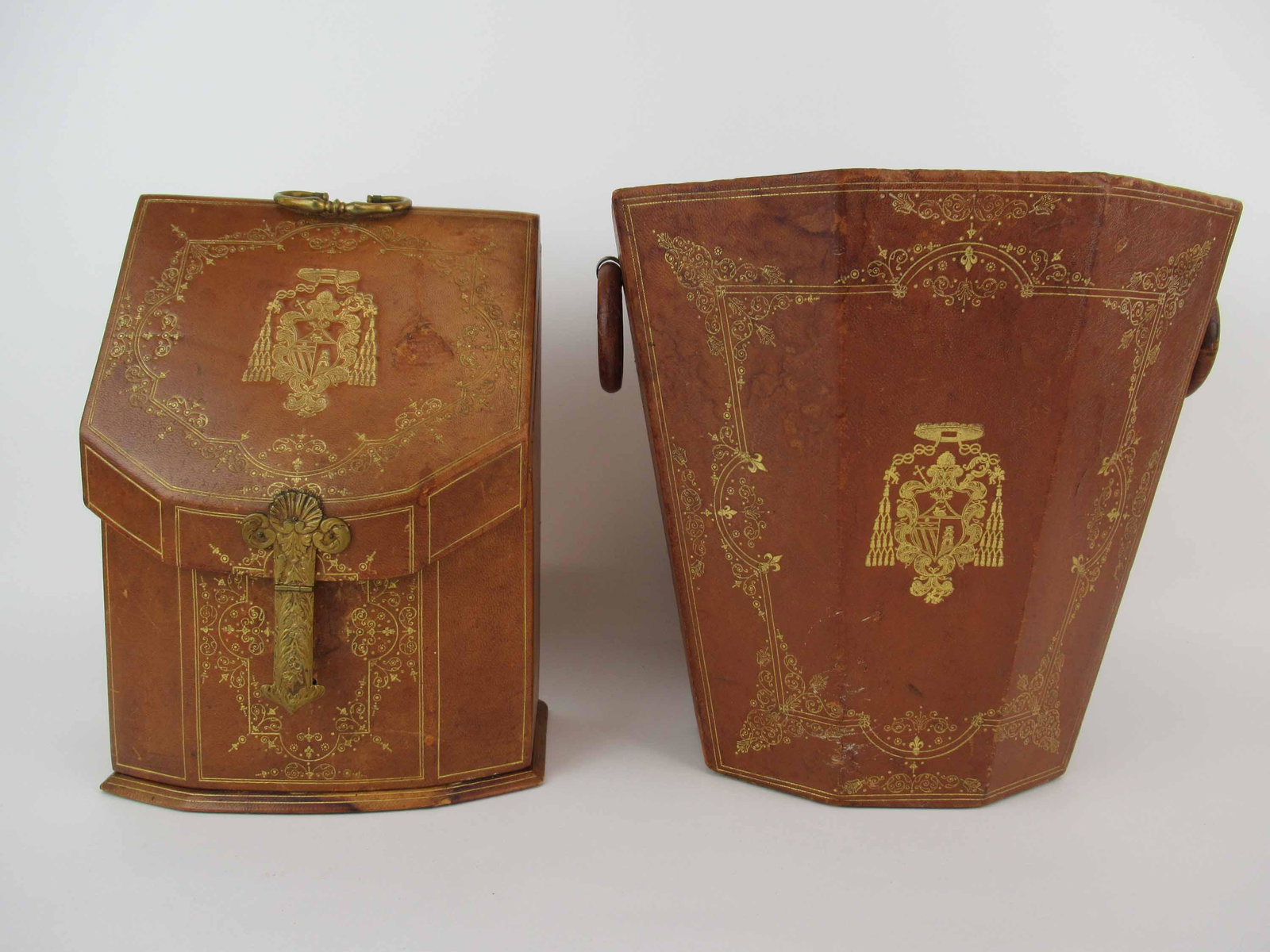 Gilt Tooled Leather Waste Basket and Letter Box: Gilt Tooled Leather Waste Basket and Letter Box. Used condition, wear, losses to rings, loose top of letter box, cracks to leather and stains. Waste basket size 11 3/4" tall x 11 5/8" x 9 1/4"