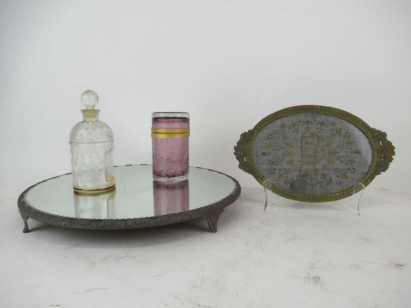 Victorian Copper Mounted Dresser Plateau: Victorian Copper Mounted Dresser Plateau with Fleur De Lis design. Together with a crackle glass dresser box, Guerlain Perfume bottle and a Victorian needlework dresser tray. Used condition, wear, wor