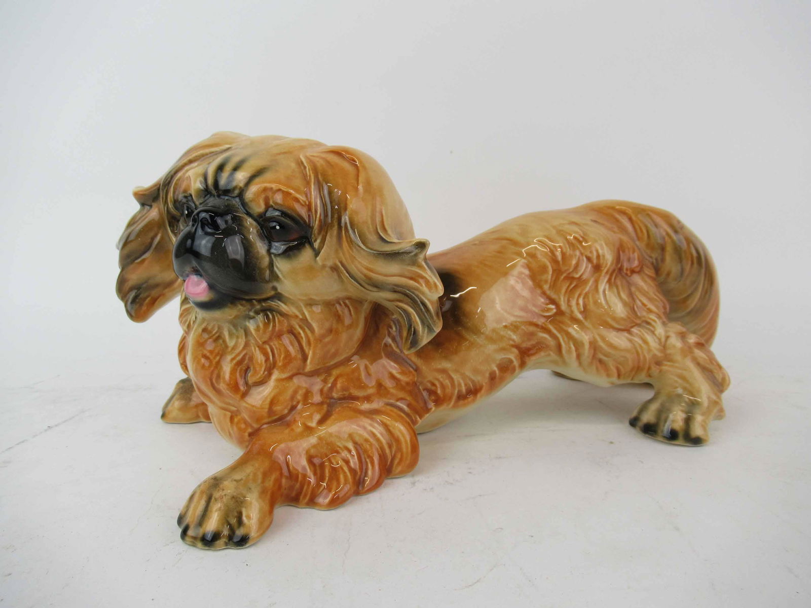 Vintage Goebel Porcelain Pekingese Dog Figurine: Vintage Goebel Porcelain Pekingese Dog Figurine, Used condition, measures 12” long x 6” wide x 6” high