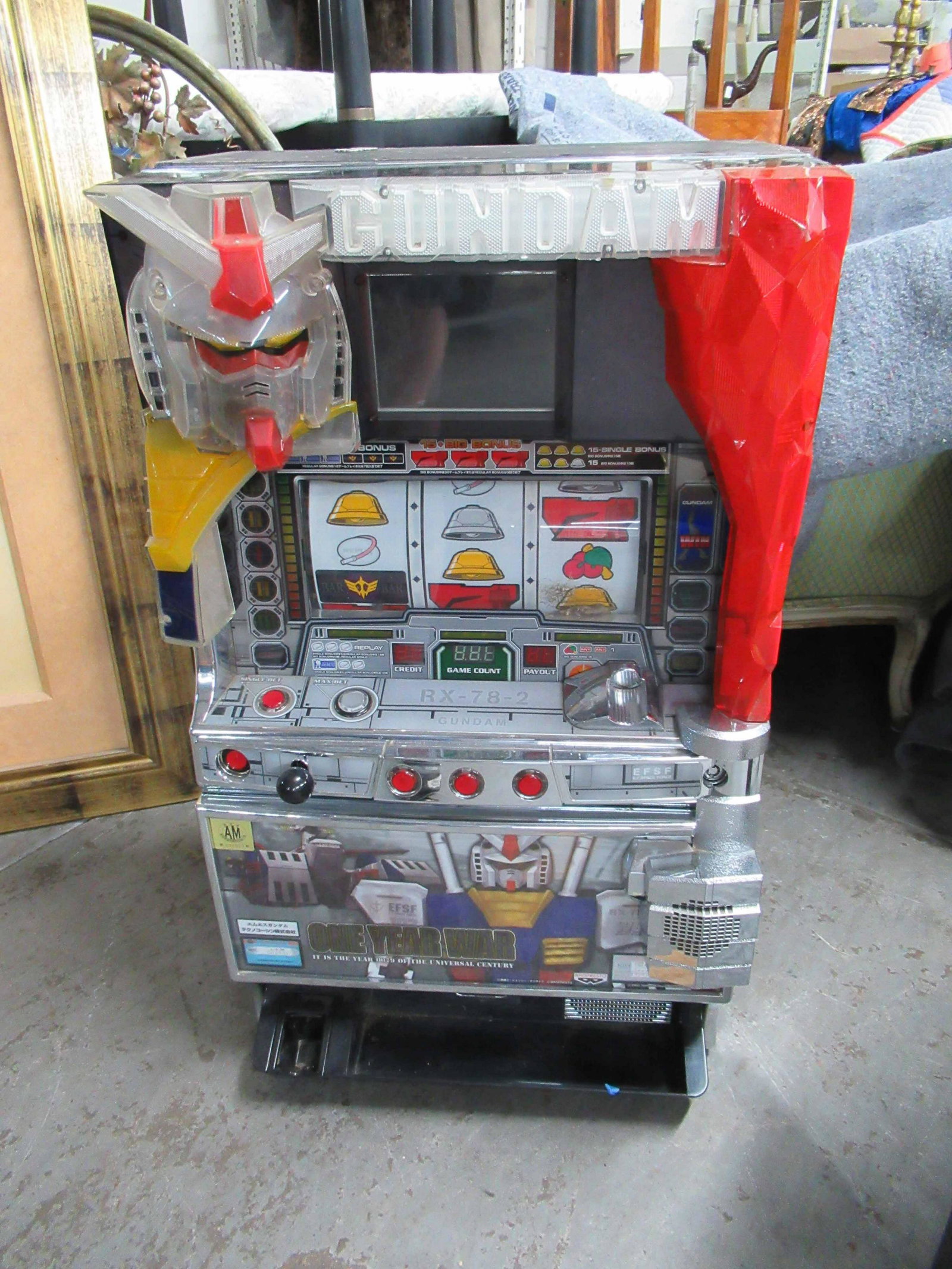 Pachino Gunkam One Year War Arcade Machine: Pachino Gunkam One Year War Arcade Machine. Unknown working condition and has not been tested. Used condition, wear, worn, scratches, maybe missing pieces or parts. 32" tall x 18 1/2" wide x 16" deep