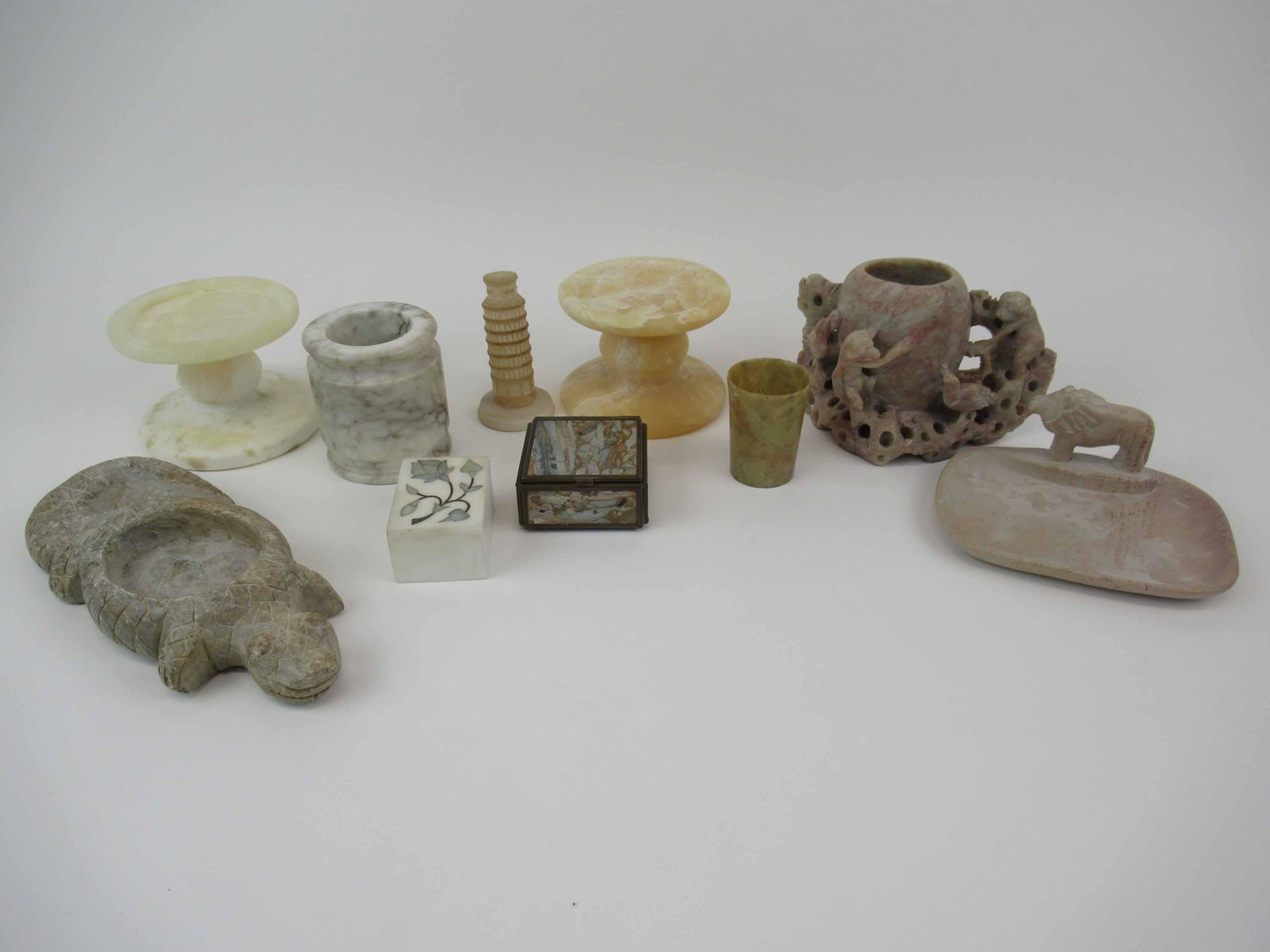 Group of Assorted Stone Table Articles: Group of Assorted Stone Table Articles. Including pair of Restoration Hardware pillar candle sticks, marble vessel, alligator, cup, trinket box, lion soap dish and monkey vase., Used condition, wear,