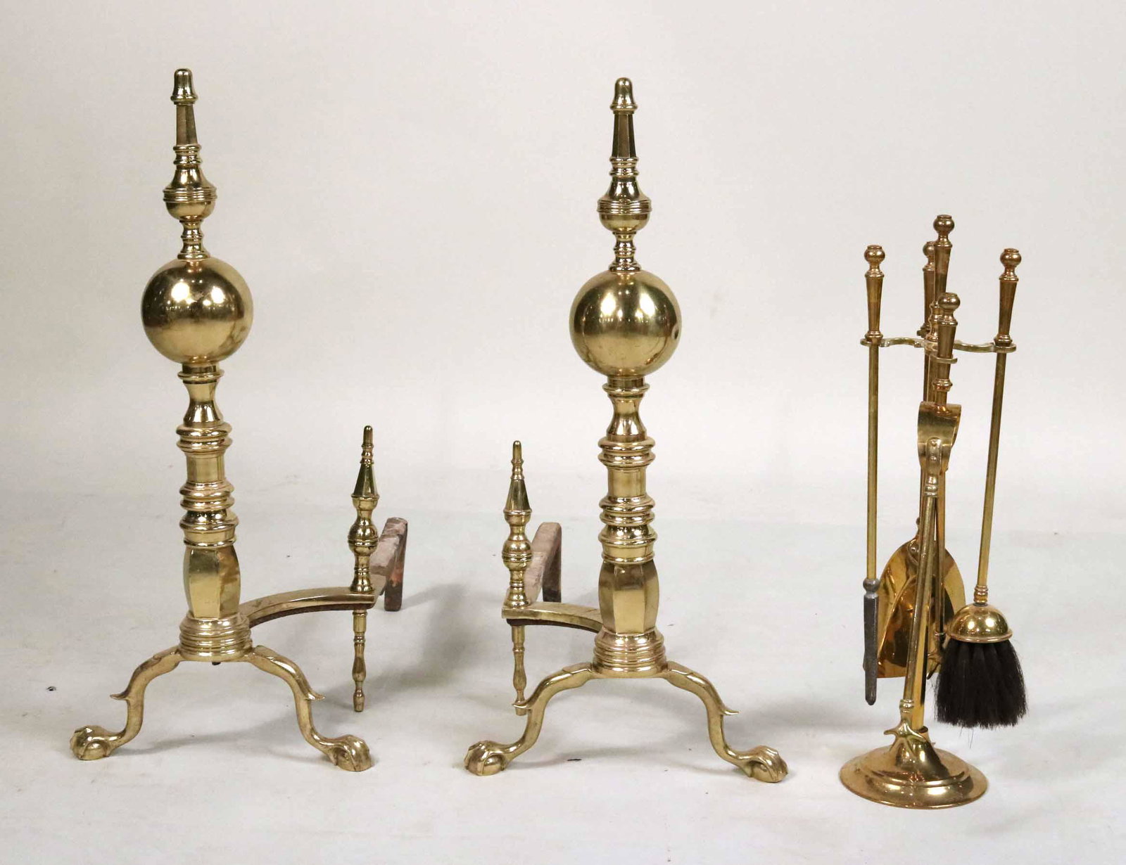 Pair of Cast-Brass Steeple Top Andirons: In the New York tradition. Together with a diminutive set of tools and stand. Andirons: 24-1/2"h x 11-1/2"w x 19"d