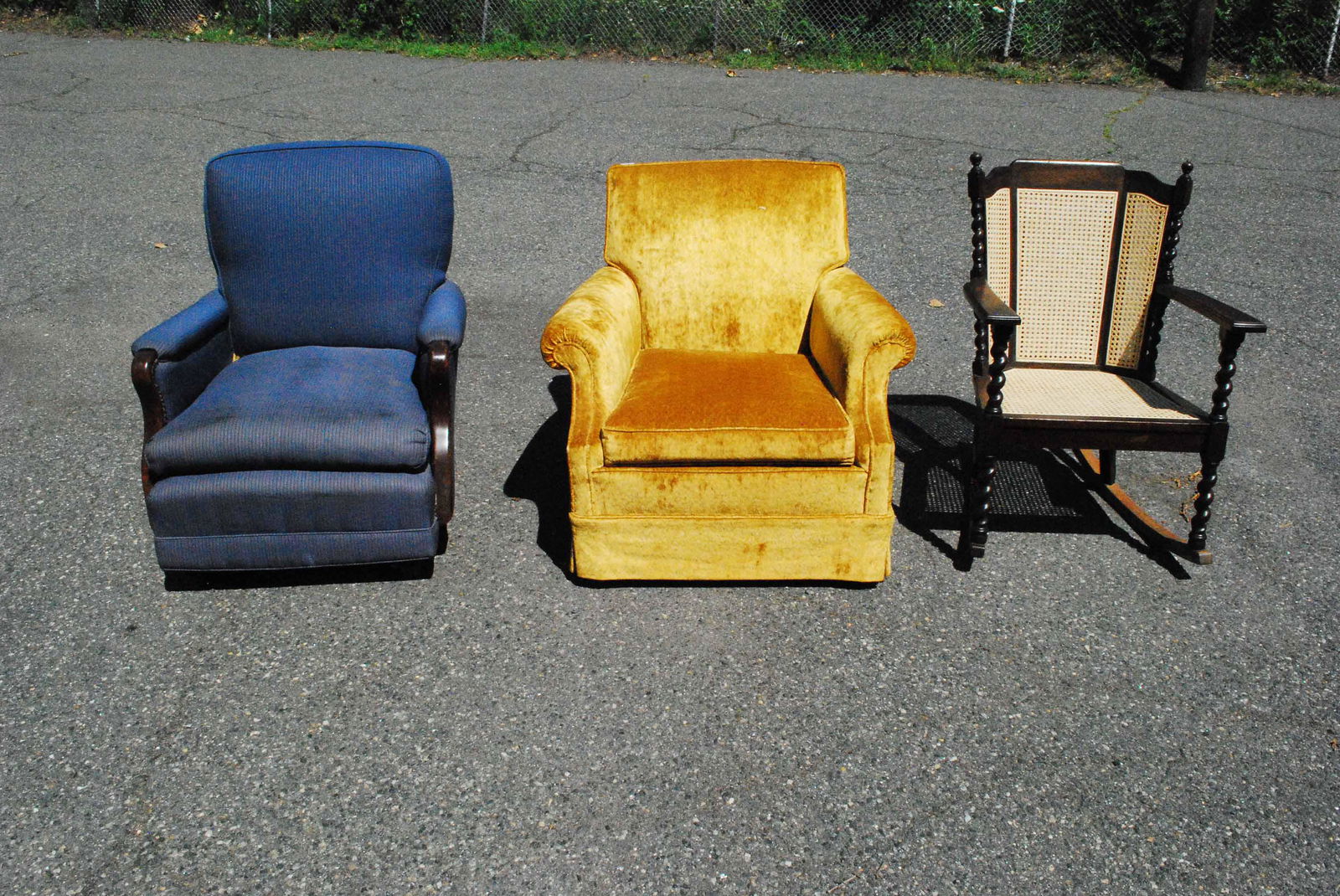 Blue Upholstered Platform Rocking Chair: Blue Upholstered Platform Rocking Chair. Together with a gold upholstered easy chair and a caned seat and backrest rocking chair. Used condition, tears, stains fading.