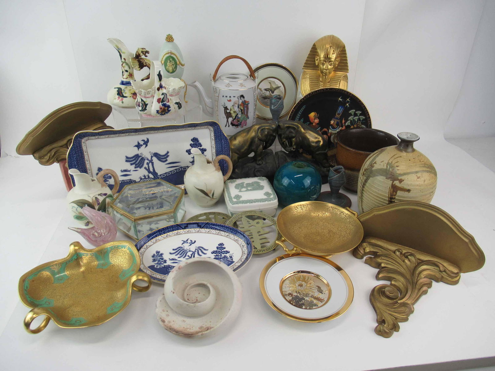 Group of Assorted Table Articles: Group of Assorted Table Articles. Including Booth Real Blue Willow, Jim Sockwell vase, Larry Allen candlesticks, Noritake, Limoge, vases, elephant book ends and pair of wall brackets. Used condition,