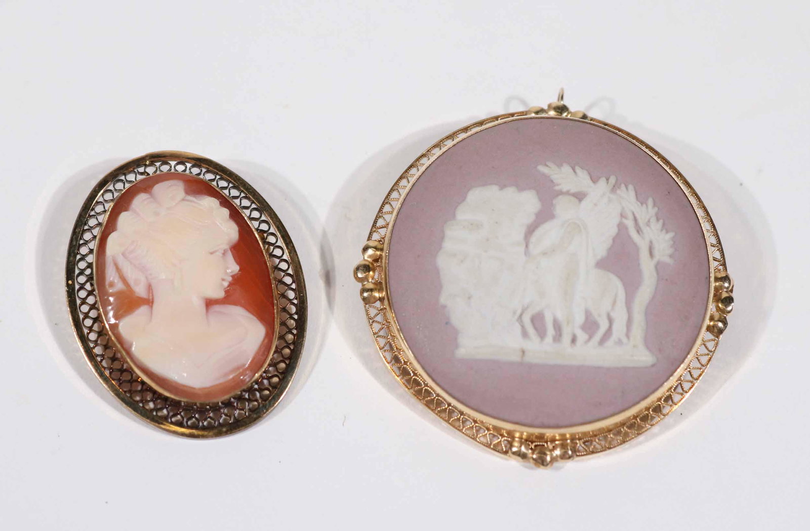Wedgwood Gold Metal Mounted Jasperware Pendant: Lavender & white classical scene, 1-1/2"d. Together with gold filled mounted oval carved shell cameo of right profile classical woman, 1-1/4"l.