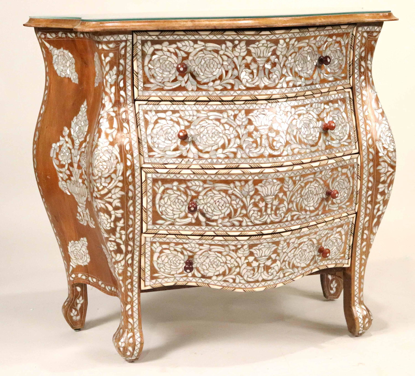 Moroccan Mother-of-Pearl Inlaid Bombe Commode: Mid-20th C. Losses to inlay. 33-1/4"h x 36-1/2"w x 19"d Provenance: From the Collection of Michael Douglas and Catherine Zeta-Jones's Bedford, NY Home