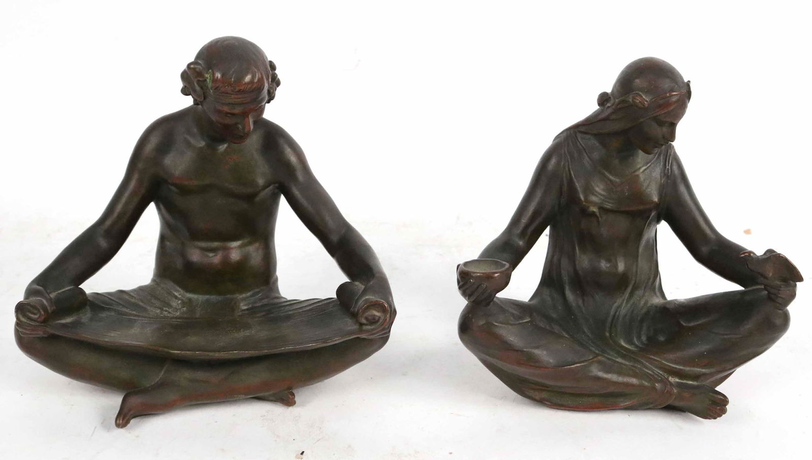 Pair of Abastenia St Leger Eberle Bronze Bookends: (1878-1942) "Omar Khayyam" Bookends, 1913, copyright 1913 A. Eberle, cast by Griffoul, Newark, NJ, male figure stamped "Tiffany & Co. New York". 6"h x 7"w x 4-1/4"d and 6"h x 6-1/2"w x 4"d