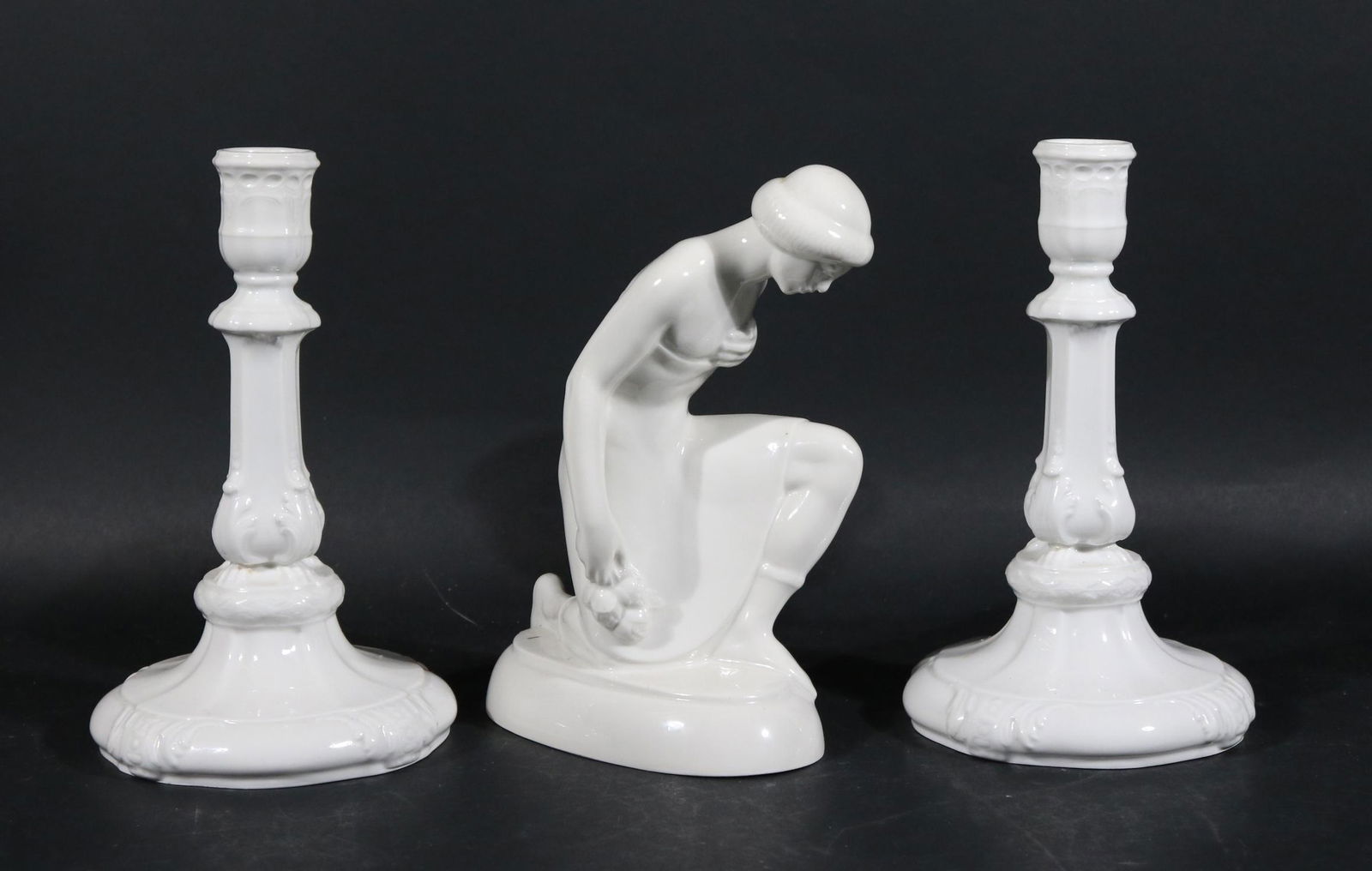 Two KPM Blanc de Chine Porcelain Candlesticks: Near Pair of KPM Blanc de Chine Porcelain Candlesticks. German, 20th C. Together with a KPM blanc de chine "Kneeling Kurd" sculpture, German, 20th C. (marked 9612). Candlesticks: 7-3/4"h Kneeling Kurd