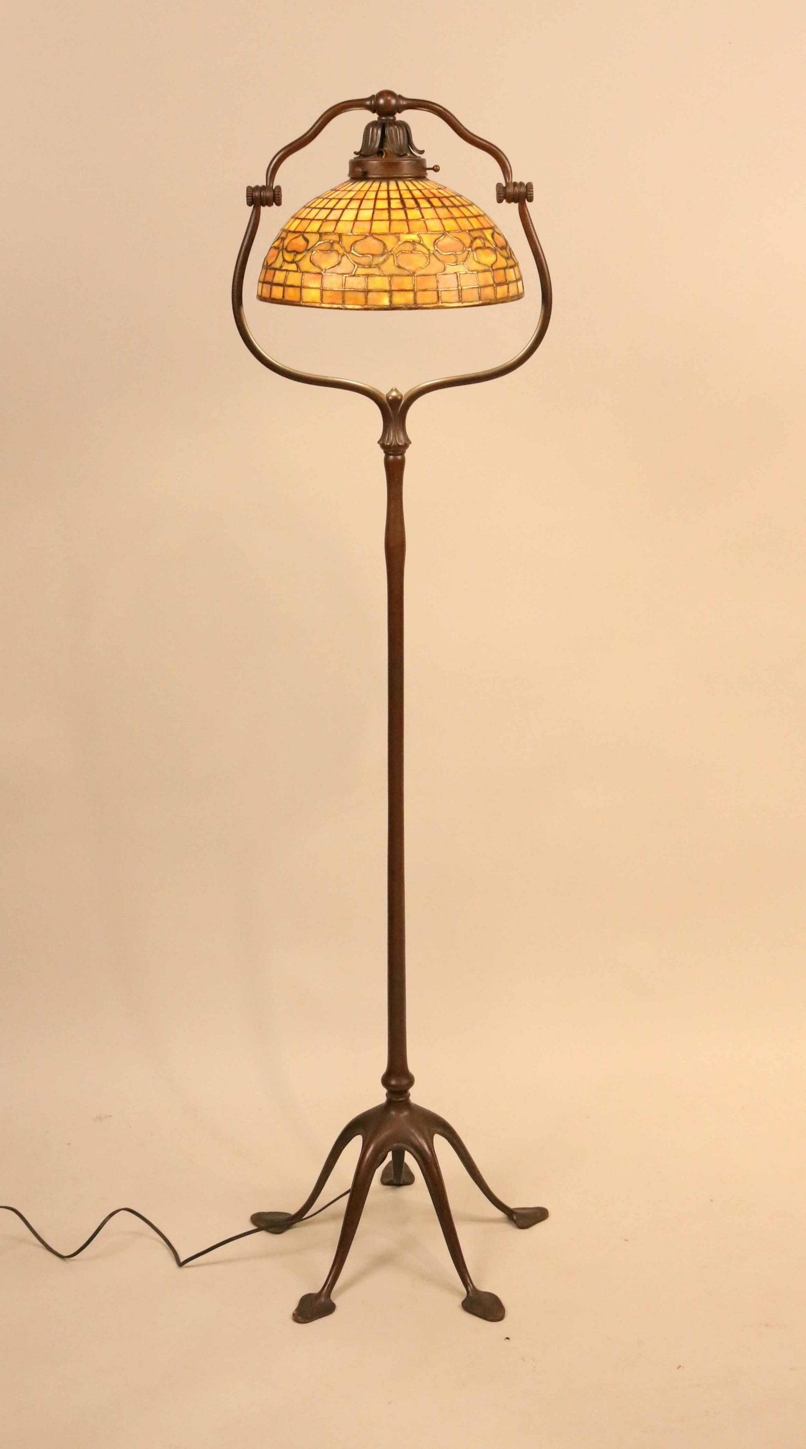 Tiffany Studios Cast Bronze Split Harp Floor Lamp: American, early 20th C. with acorn pattern amber shade.4'10"h x 15"dia.Provenance: Purchased by consignor's grandparents from Estate of Evalyn Walsh McLean Auction, 1948, see link below for auction ca