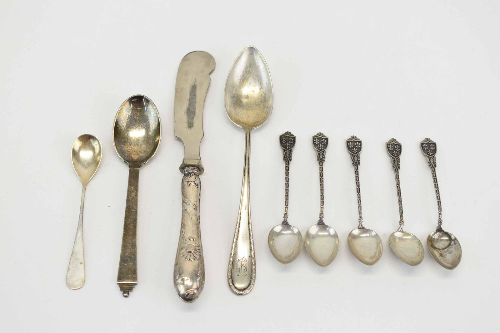 Georg Jensen Denmark Pyramid Sterling Teaspoon: Gorge Jensen Denmark Pyramid Sterling Teaspoon with JAY on verso, measures 5 5/8" long. Together with an assortment of 800 Silver stamped German 5 demitasse spoons with shield handle, a monogrammed so