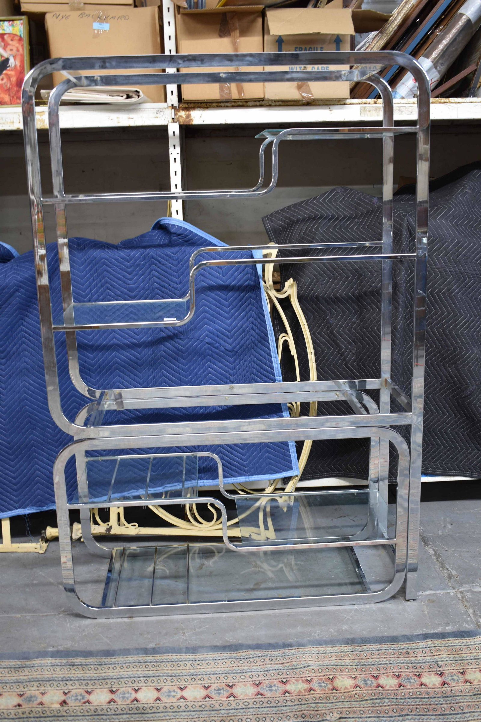 Pair of Modern Chrome Etageres: Pair of Modern Chrome Etageres with glass shelves. Used condition, wear, worn, chips to glass shelves. 78 1/2" tall x 14" deep x 31" wide