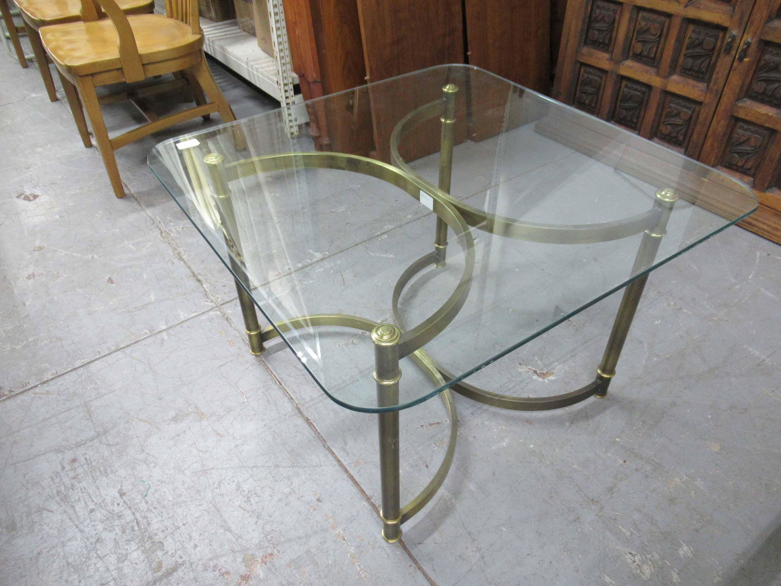Modern Glass Top Occasional Table: Modern Glass Top Occasional Table with glass top resting on faux bronze steel base; used condition, wear/worn, glass top size 32" x 32"