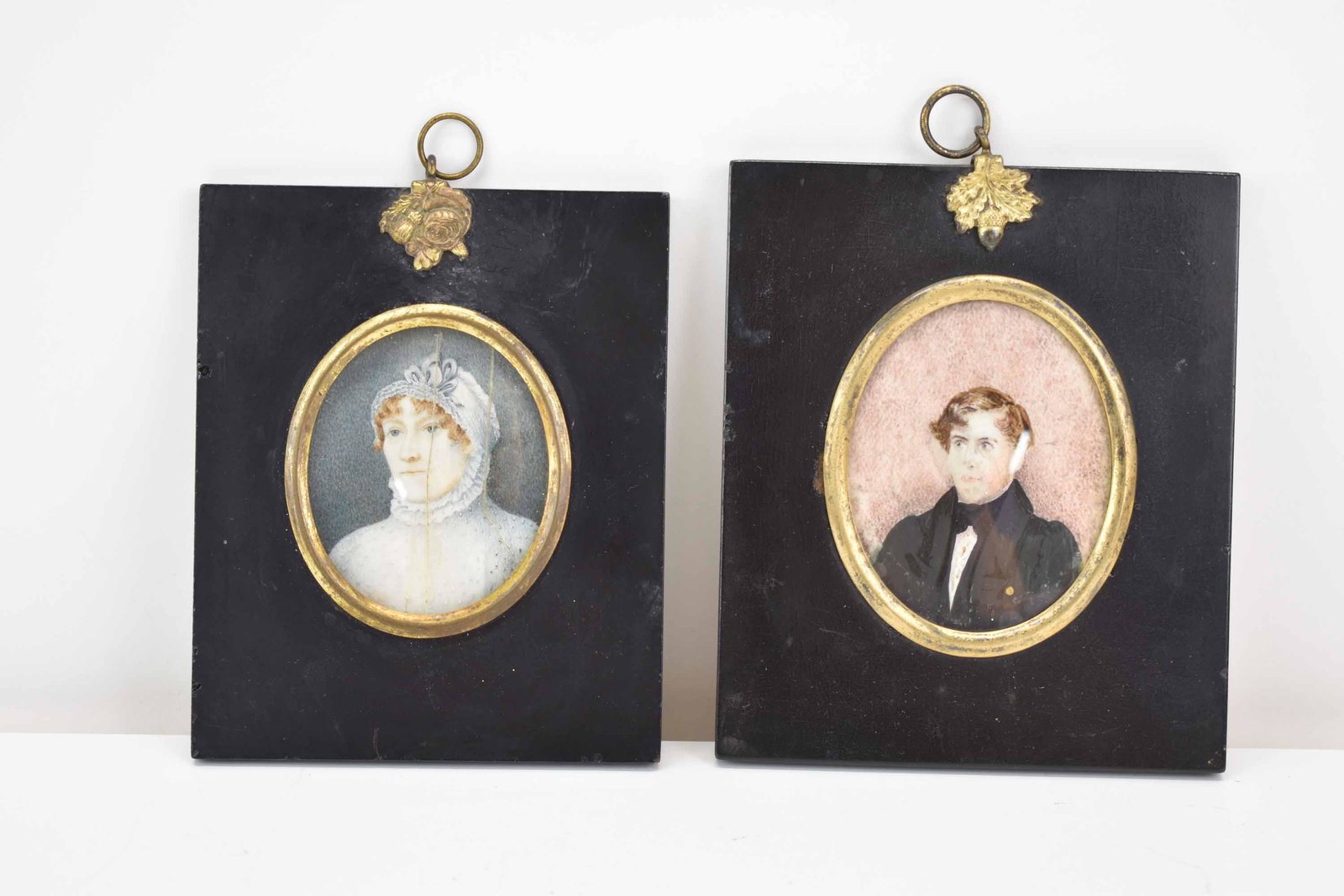 Two Antique Portrait Miniatures of Man and Woman: Two Antique Portrait Miniatures of Man and Woman on bone. Used condition, wear, worn, splits, breaks and repairs. Largest Framed Size 4 3/4" x 4 1/8"