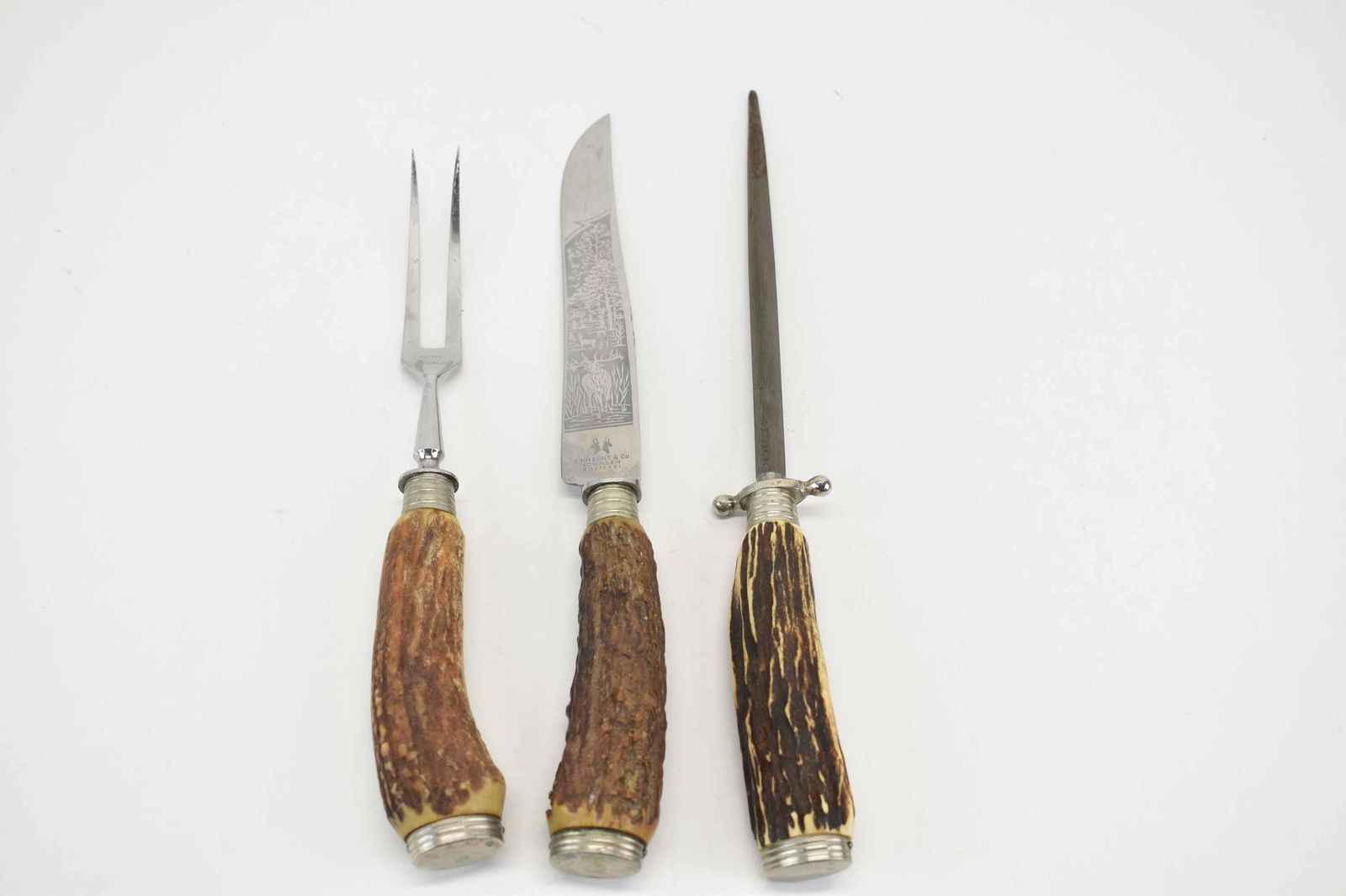 German Bone Handled 2 Piece Carving Set: E. Knecht & Co. Together with a similar bone handle knife sharpener. Size: Knife 13"l