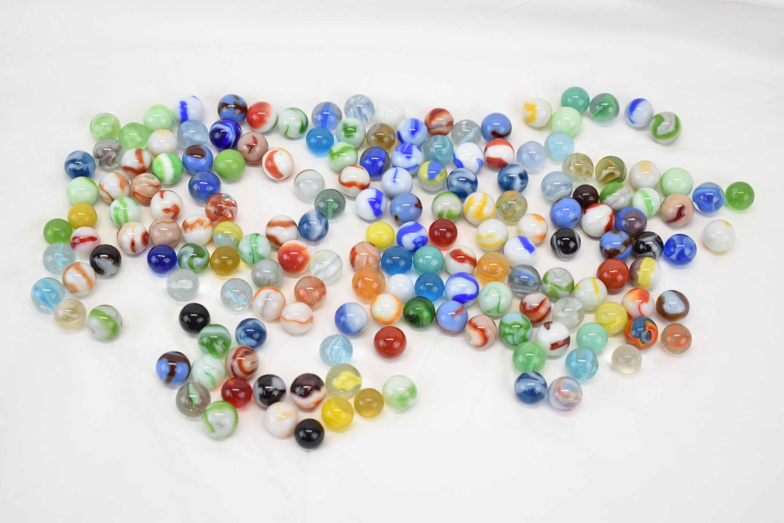 Group of Assorted Vintage and Antique Marbles: Group of Assorted Vintage and Antique Glass Marbles comprising of small marbles of various colors and designs; Used condition, wear, worn, chips