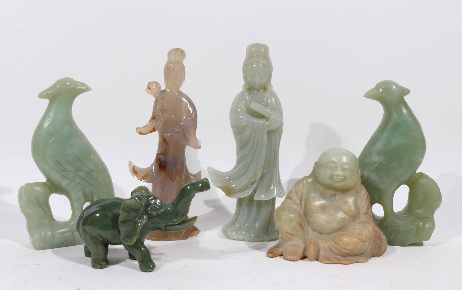 Six Carved Jade & Hardstone Figures and Animals: Chinese, comprising two birds, an elephant, a buddha, and two female deities. Tallest: 7"h