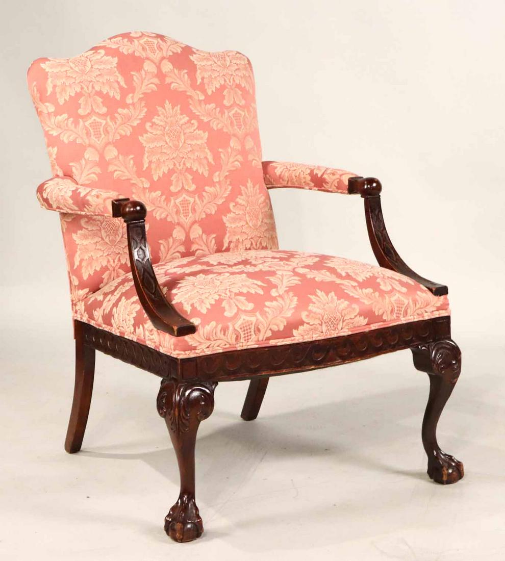 George III Style Carved Mahogany Library Armchair: 20th C., with pink upholstery. Arm loose. 36"h x 25-1/2"w (seat)