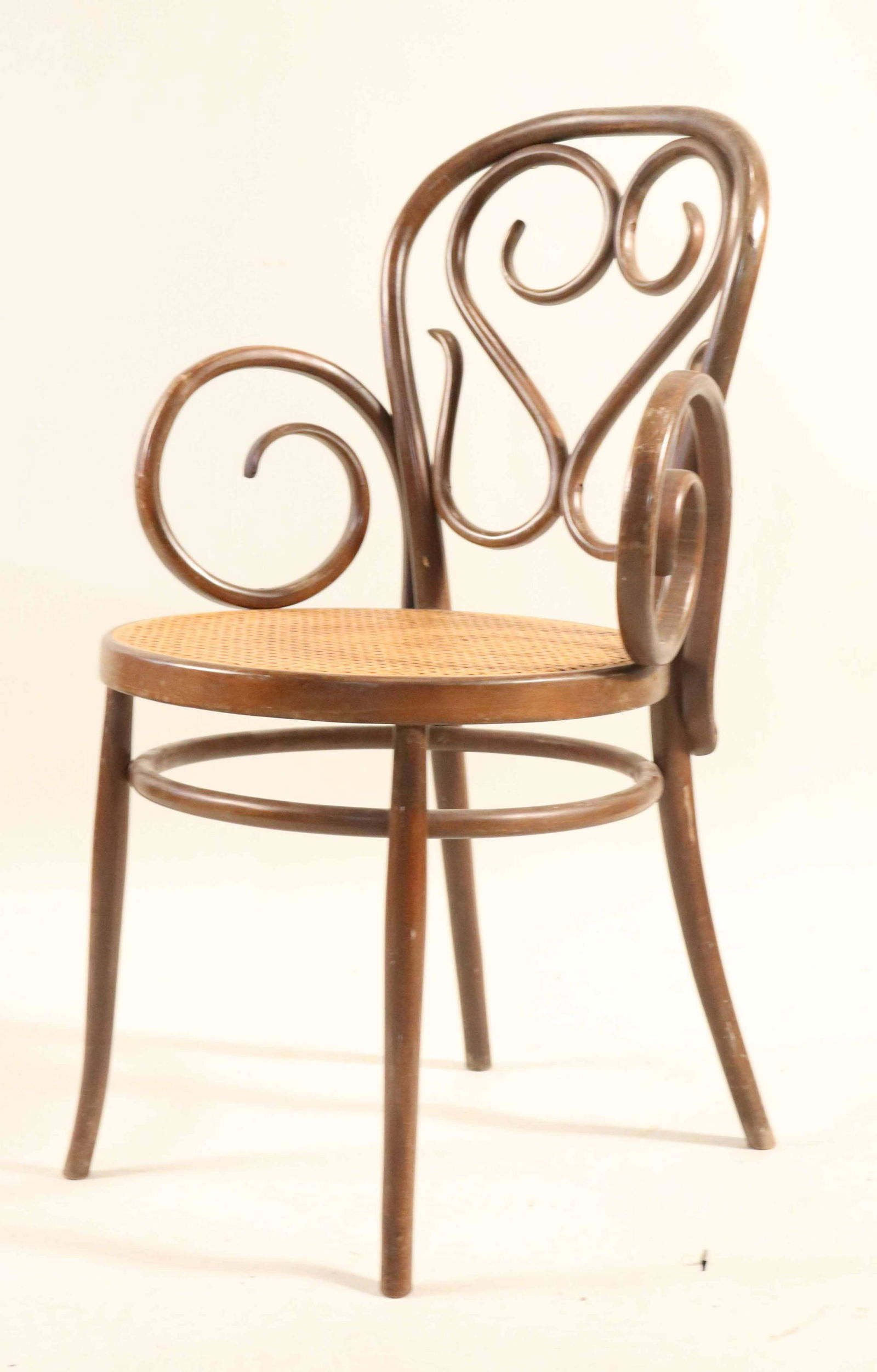 Vintage Bentwood Caned Armchair: Some distress. 35"h