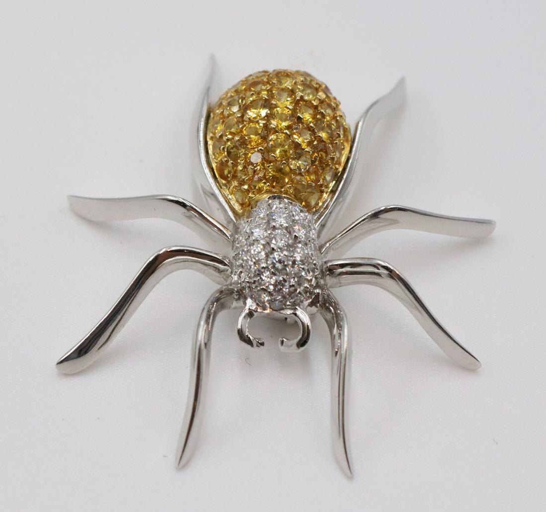 Yellow Diamond 18K White Gold Spider Brooch: A DIAMOND SPIDER BROOCH the yellow diamond body to the white diamond pave head, atop 18k white gold legs, with double pin stem METAL: 18 karat white and yellow gold STONES: yellow diamonds weighing ap