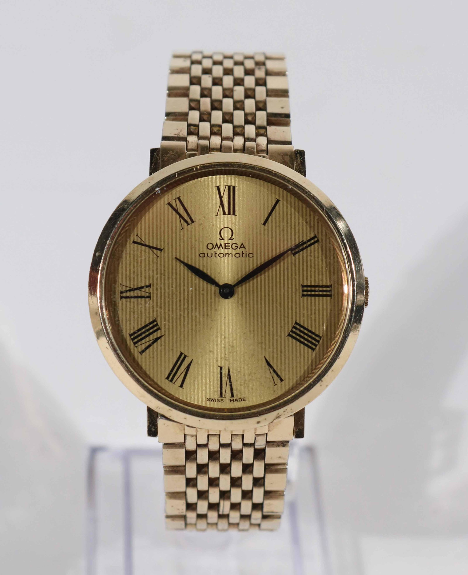 Vintage Omega Gold Filled Automatic Dress Watch: Vintage Omega 10K gold filled gentleman's dress watch with Omega bracelet wear/worn/light scratches to case and crystal but in overall Good condition, automatic movement, swiss made, hour and minute h