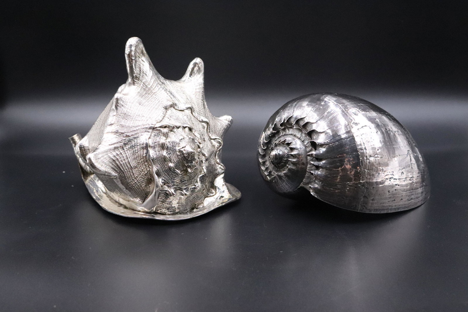 Large Sterling Silver Overlay Conch Seashell: Stamped, 925. Together with a Ruzzetti and Gow silver overlay shell. 7"h x 7"w Property from a Short Hills, NJ and San Francisco, CA Private Collection