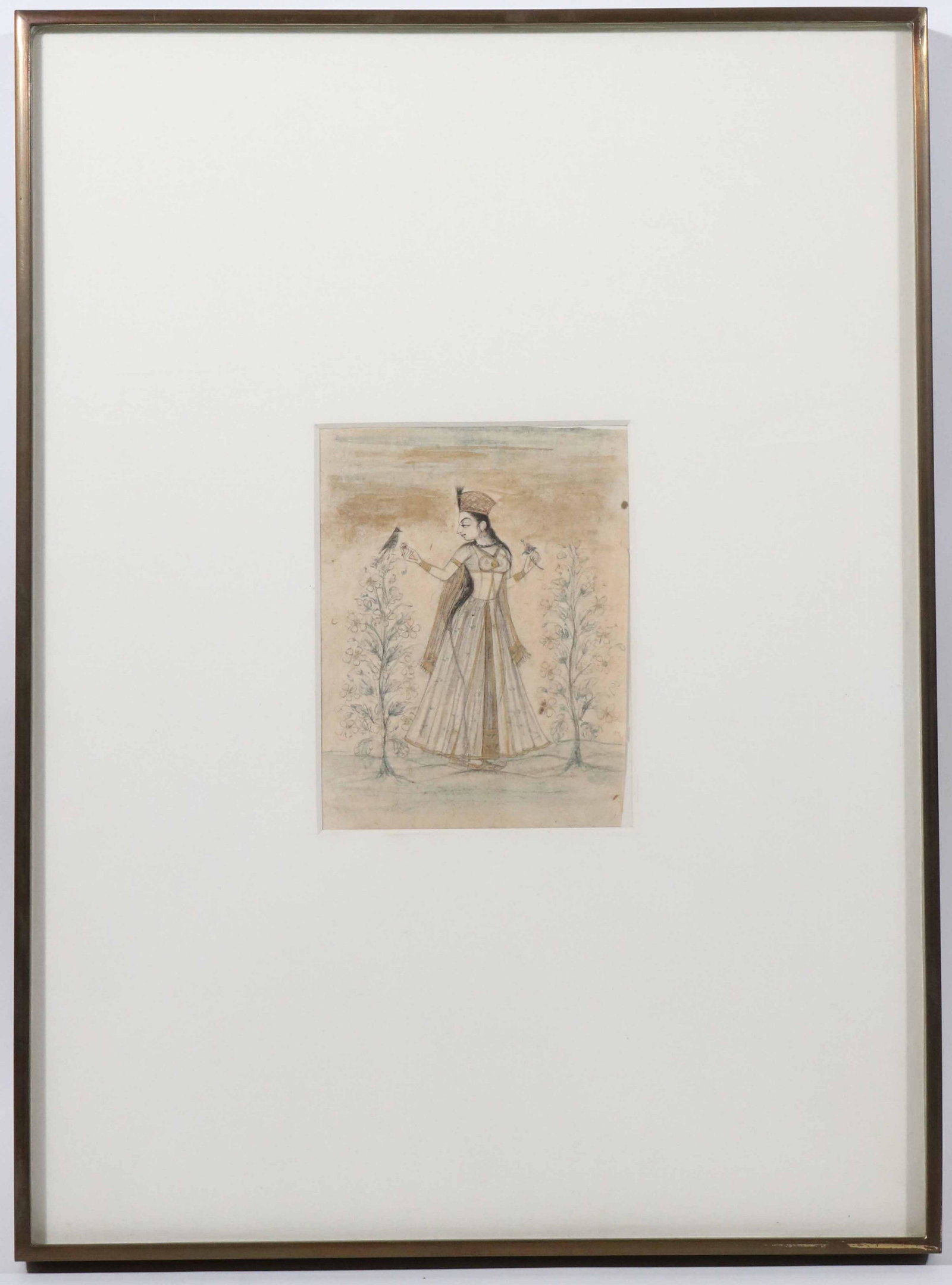 Indian Drawing with Color Wash Miniature Painting: C. 1725, in a garden, portrait of a courtesan Lucknow plucks a flower while offering food to a tame bird, Moghul, Bikaner, CA. Sight size: 5"h x 3-3/4"w Provenance: Doris Weiner Gallery, New York, NY