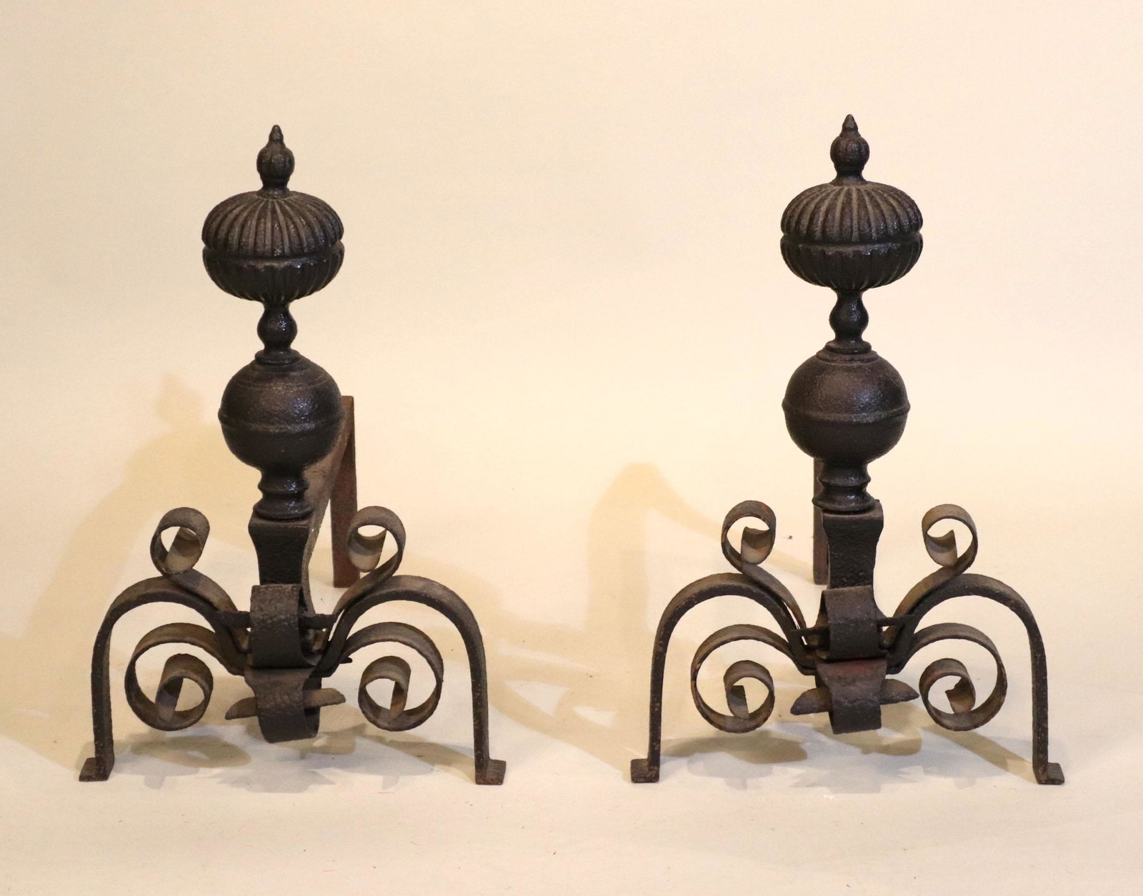 Pair of Baroque Cast-and-Wrought Iron Andirons: English, 17th C. Wear, surface distress. 21-1/2"h x 13-1/2"w x 23"d