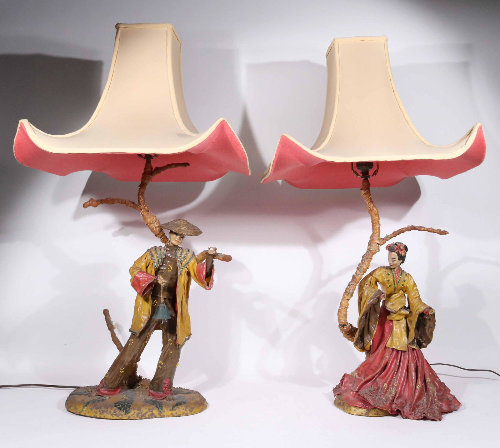 Pair of Papier Mache Chinese Figural Lamps: 20th C. with pagoda form shades. Losses and wear. 29-1/2"h x 11"w x 8"d
