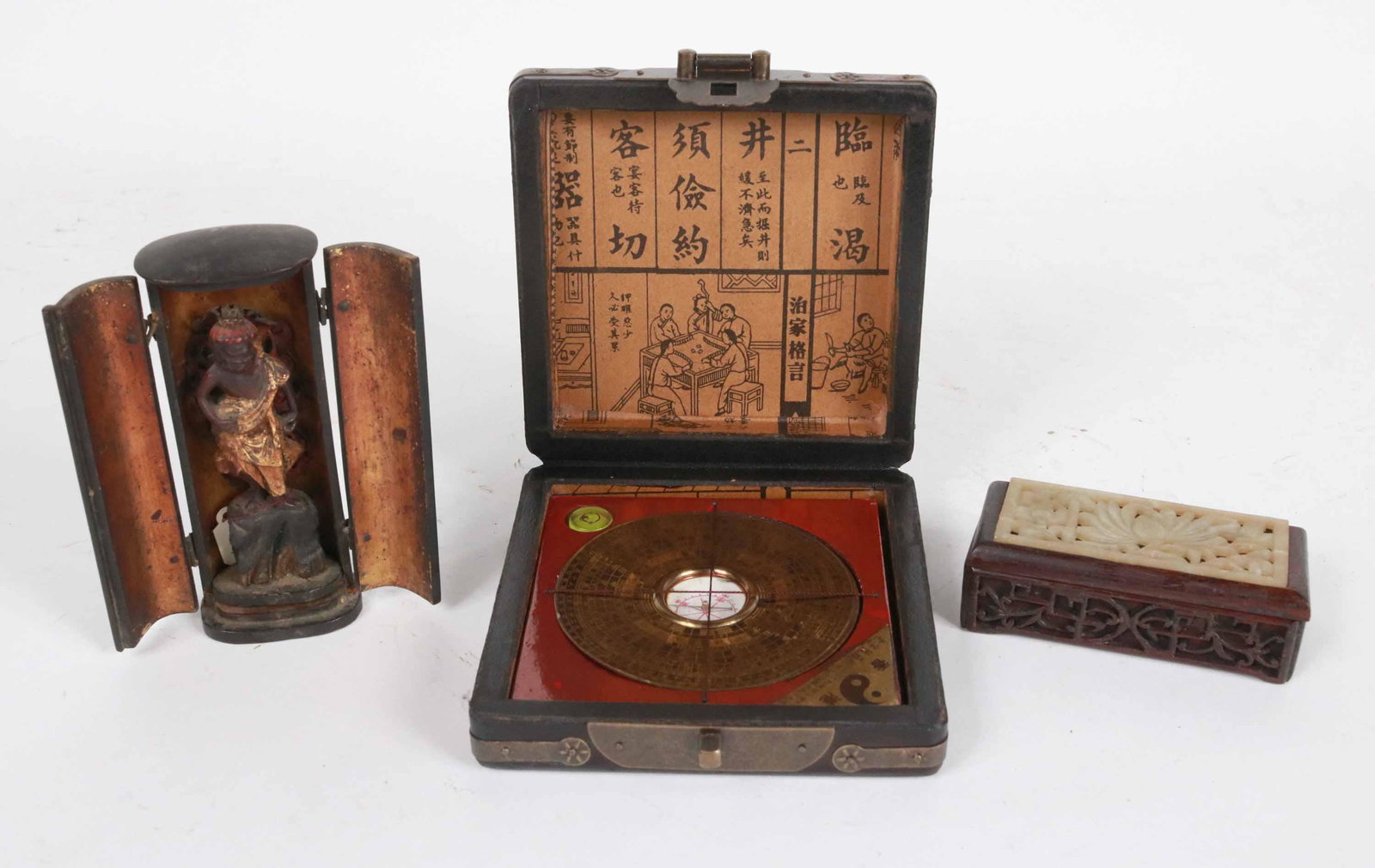Three Chinese Covered Boxes: Comprising, one with carved hardstone inset lid, one with altar figure inside, and one fitted with a compass. Wear and losses. 1-1/2"h x 4"w x 1-3/4"d, 5"h x 2"w x 1-1/2"d, and 1-1/2"h x 5-1/4"w x 5-1