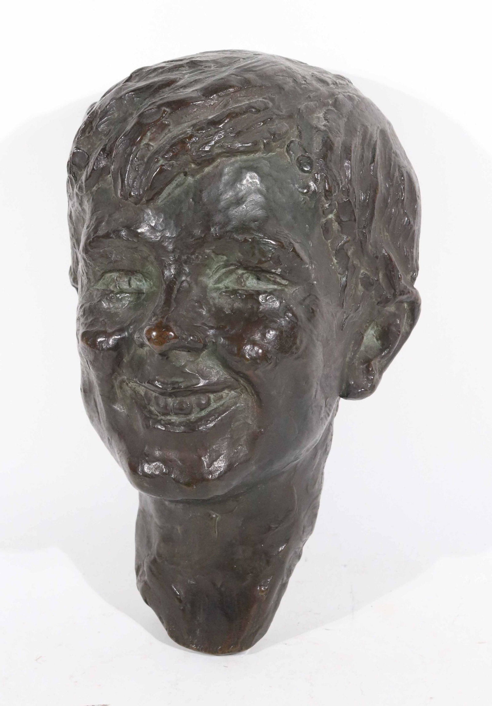 Gorham Founders Bronze Wall Bust of Smiling Boy: Marked Gorham Founders and signed E.M. Greene, with hook to hang on the wall. 12"h 7-3/4"w x 6"d
