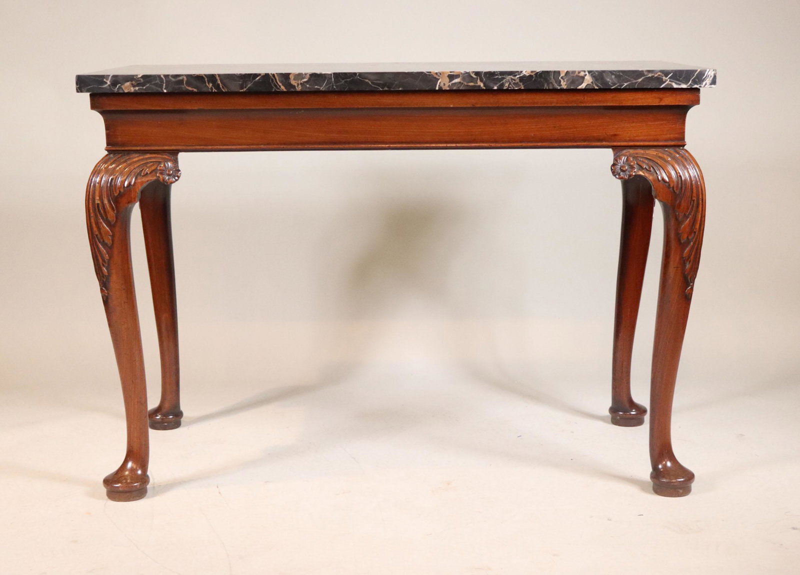 George II Carved Mahogany Marble Top Pier Table: Probably Irish, 18th C. 34"h x 48-1/2"w x 24-1/4"d Provenance: Property from the Estate of Robert K. Johnson of Maine and South Carolina